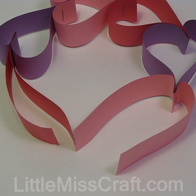 Heart wreath made with construction paper and staples!  For Valentines Day, weddings or birthdays!